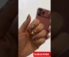Apple 18 pro max with luxury nail arts.